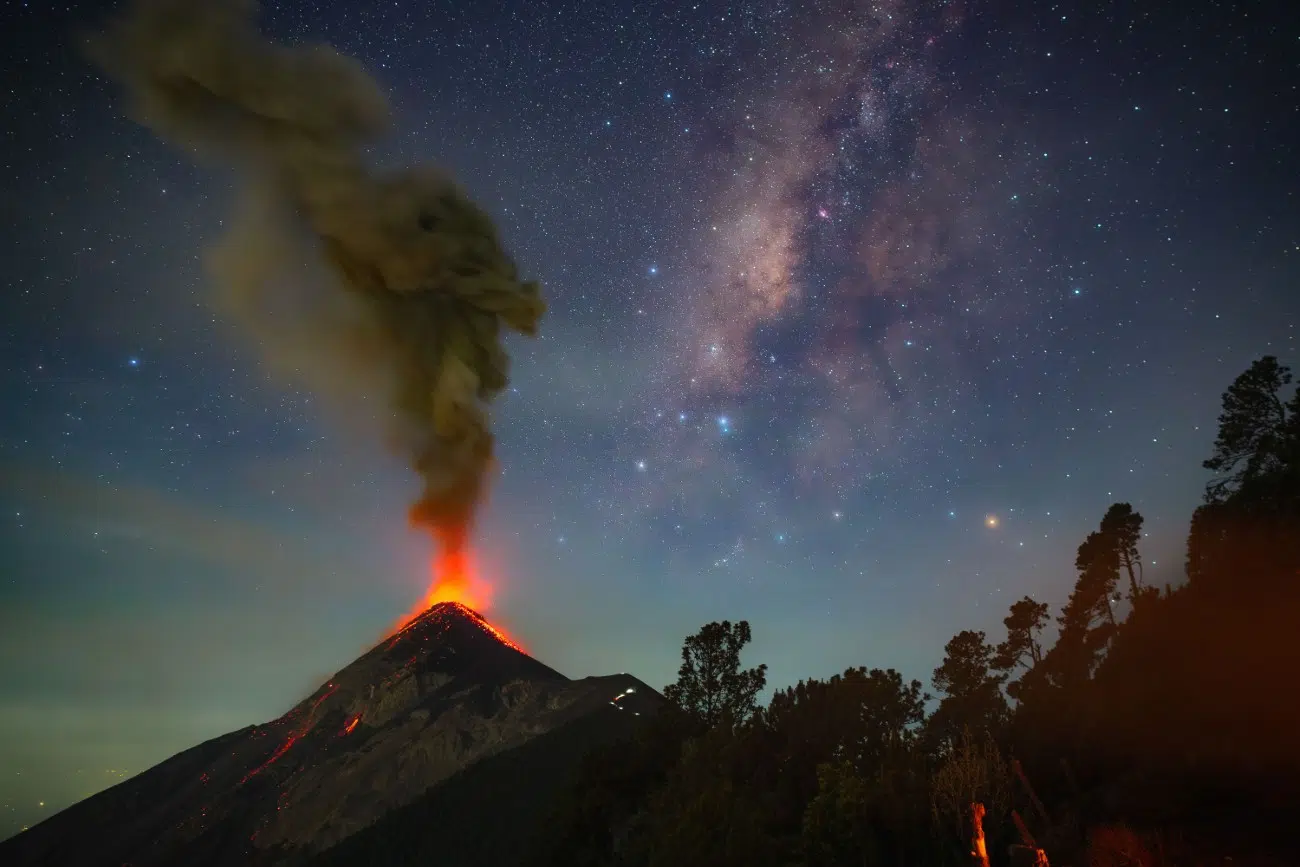 Acatenango Volcano spewing lava with Milky Way in the background