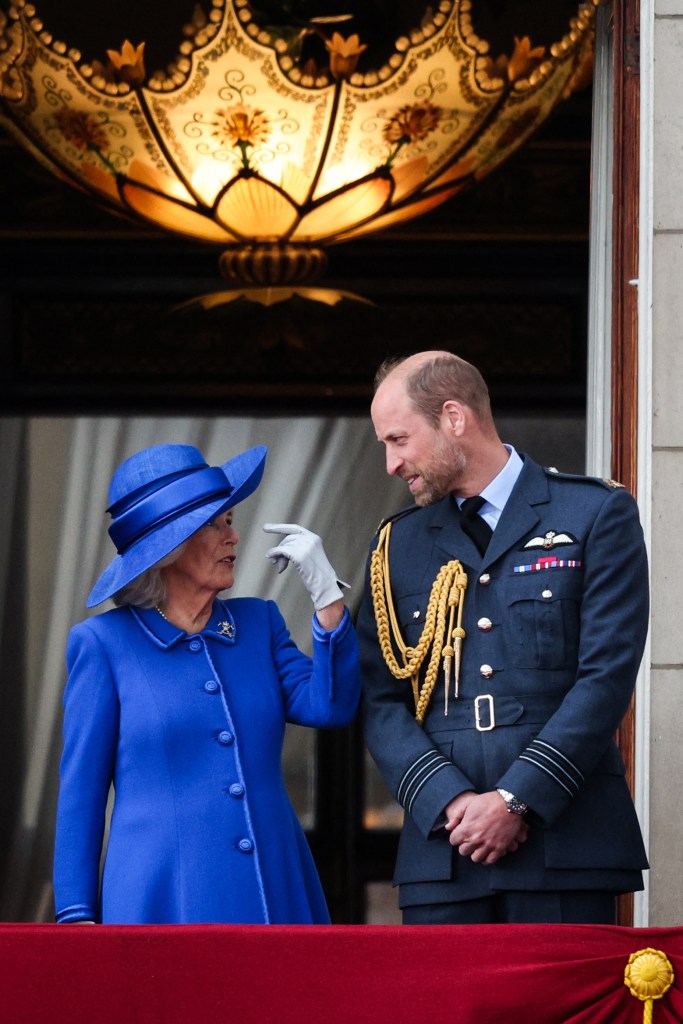 Prince William and Queen Camilla have a chat on the balcony.