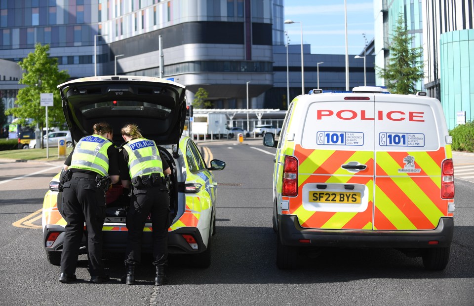 Police officers at Queen Elizabeth University Hospital in Glasgow, Scotland.