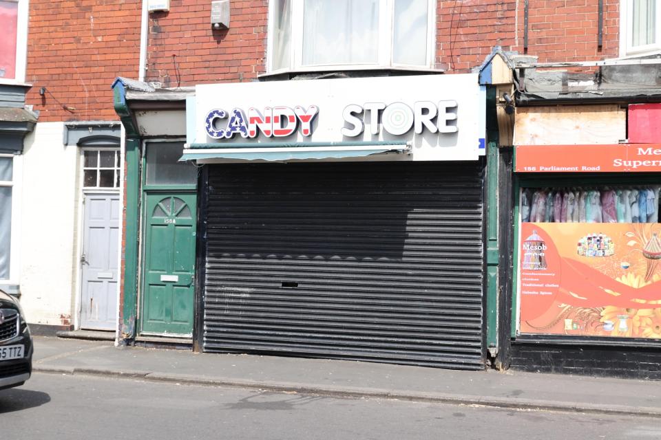 Closed candy store with American flag-themed signage on Parliament Road in Middlesbrough.