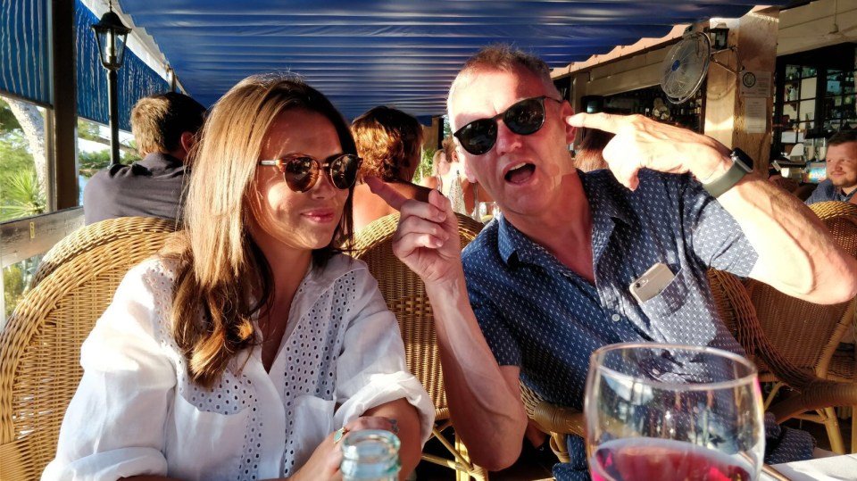 Brother and sister at an outdoor restaurant.