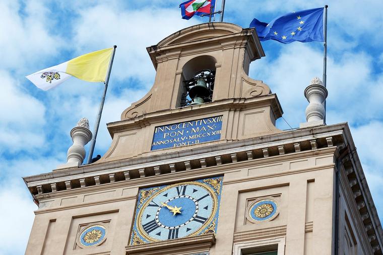 The Vatican flag (left) flies alongside the European Union flag atop the Quirinale presidential palace in Rome, as the Pope meets with the Italian president, Nov. 14, 2013.