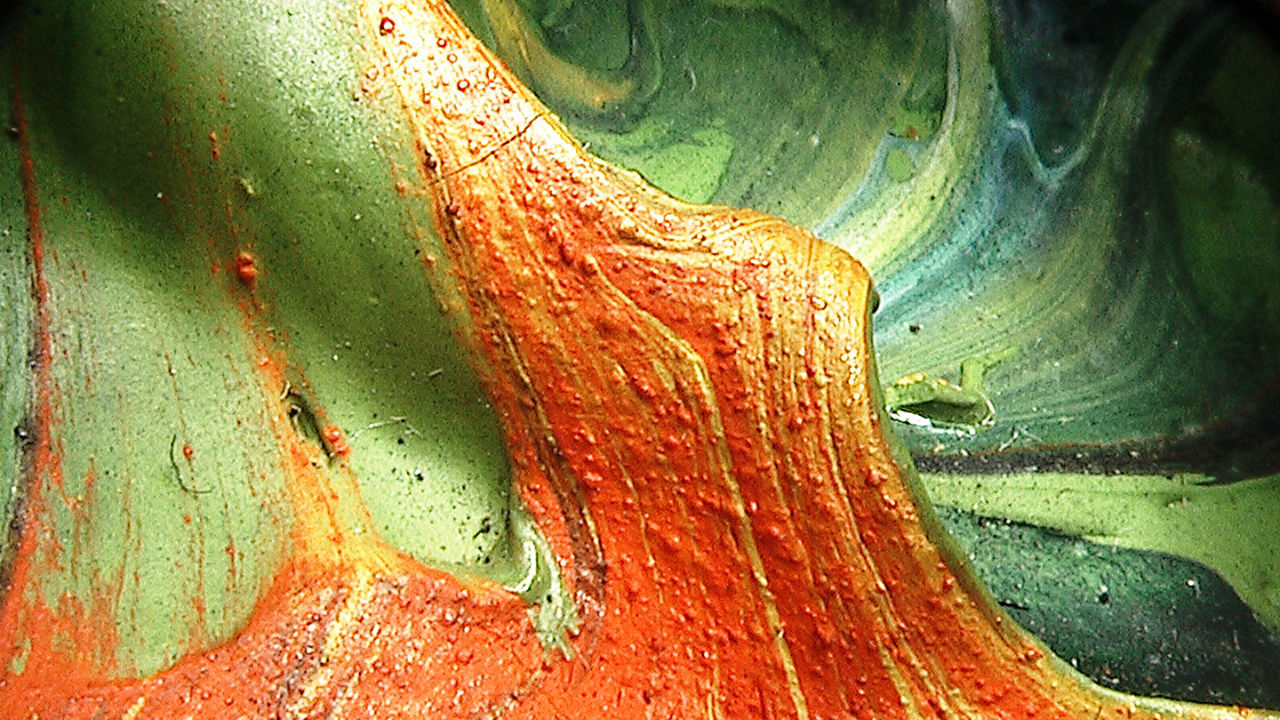 Detail of Riopelle composition 19522 showing tiny lumps in the texture of the paint.