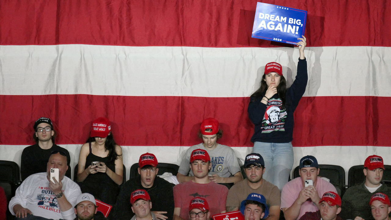 Young supporters of US President Donald Trump listen during a campaign rally.