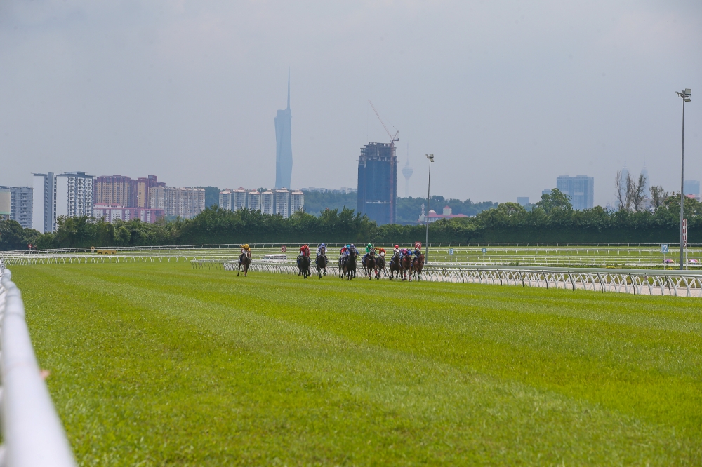 The Kuala Lumpur skyline provides a stunning backdrop to the Selangor Turf Club racetrack. — Picture by Yusof Mat Isa