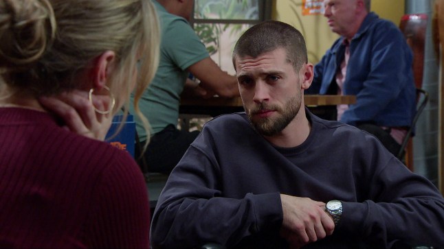 Joe looks intently at Dawn on Emmerdale