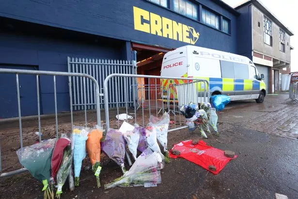 Flowers and tributes left outside Crane nightclub to Cody Fisher in Digbeth.