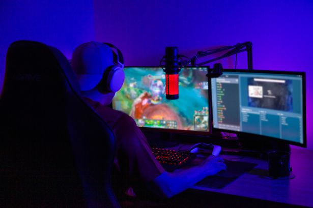 Man streaming his gaming progress from home