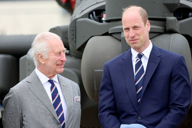  King Charles III and Prince William, Prince of Wales stand in front of an Apache helicopter during the official handover in which King Charles III passes the role of Colonel-in-Chief of the Army air corps to Prince William, Prince of Wales at the Army Aviation Centre on May 13, 2024 in Stockbridge, Hampshire. (Photo by Chris Jackson/Getty Images)