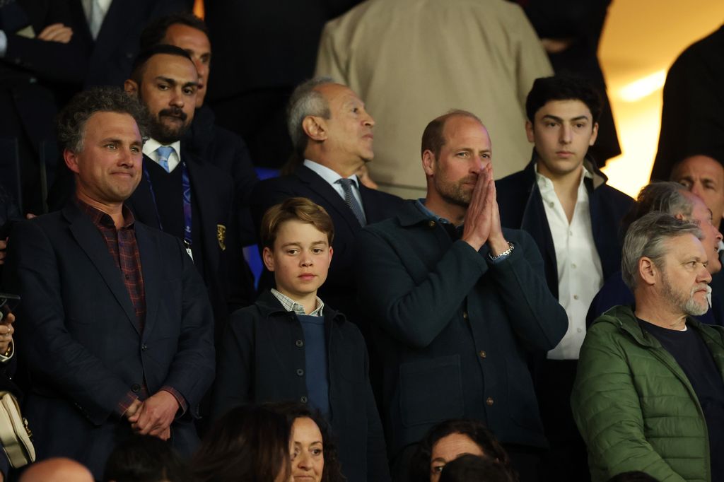Prince George and Prince William watching football