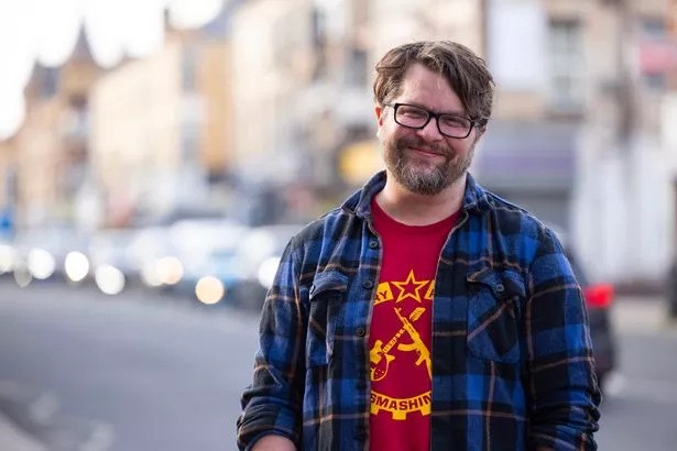 Andy Scott, co-owner of Black Cat on Smithdown Road