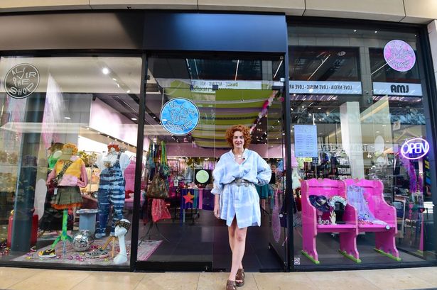 This photo shows Bethan Flanagan standing outside All Over The Shop. 