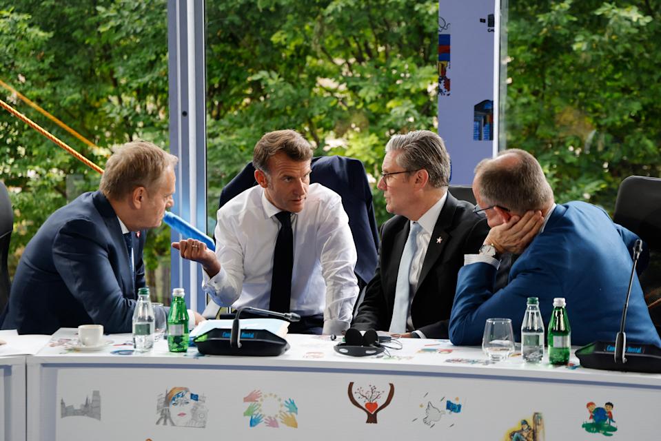 TOPSHOT - (From L) Poland's Prime Minister Donald Tusk, France's President Emmanuel Macron, Britain's Prime Minister Keir Starmer and Germany's Chancellor Friedrich Merz take part in a meeting during the European Political Community (EPC) summit, in Tirana on May 16, 2025. (Photo by Ludovic MARIN / AFP) (Photo by LUDOVIC MARIN/AFP via Getty Images)          