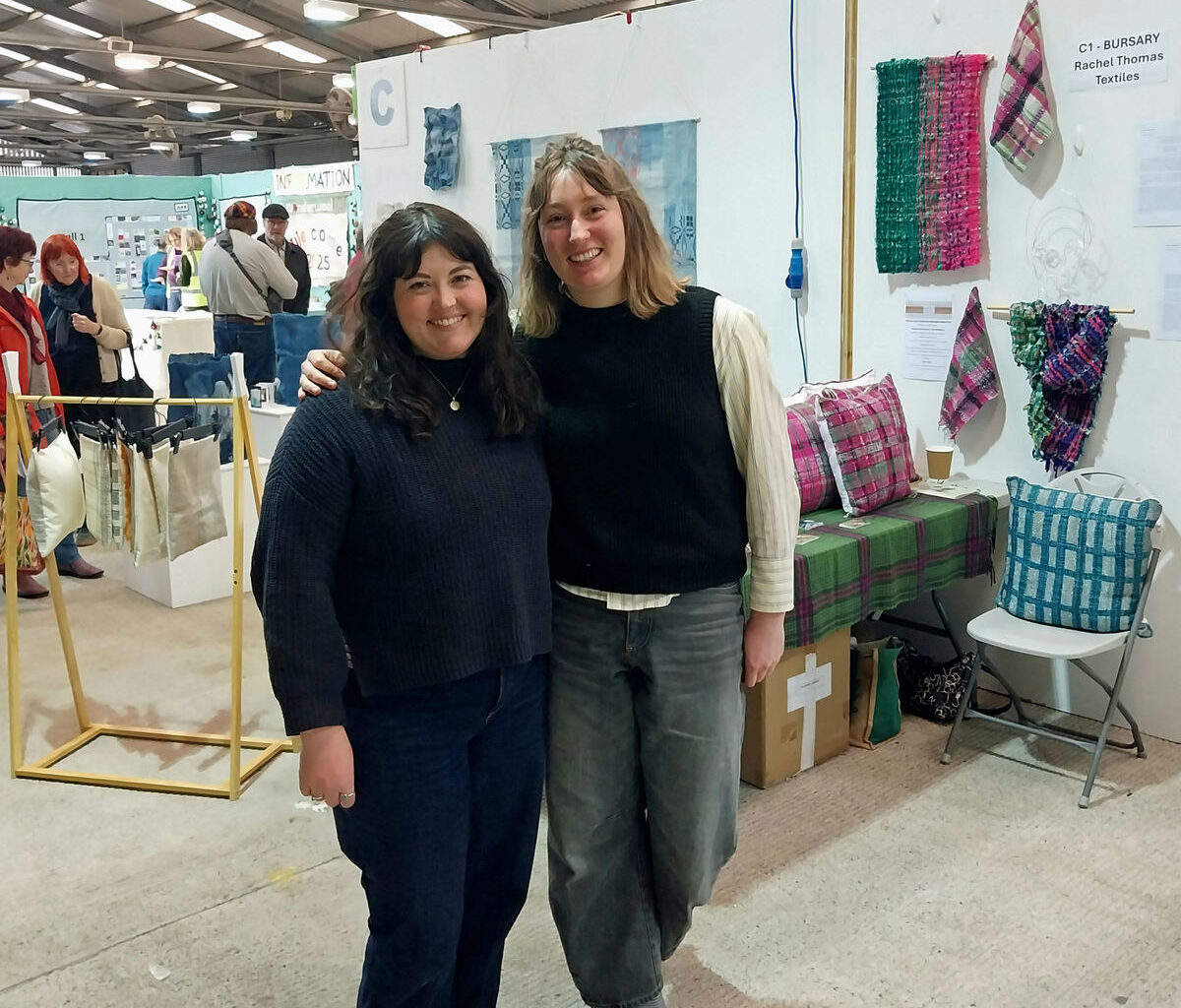 Nancy Una Simmons (left) and Rachel Thomas in front of their stands at Wonderwool Wales.