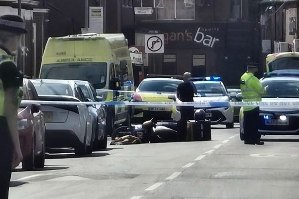 The residential road was taped off by police following the machete attack