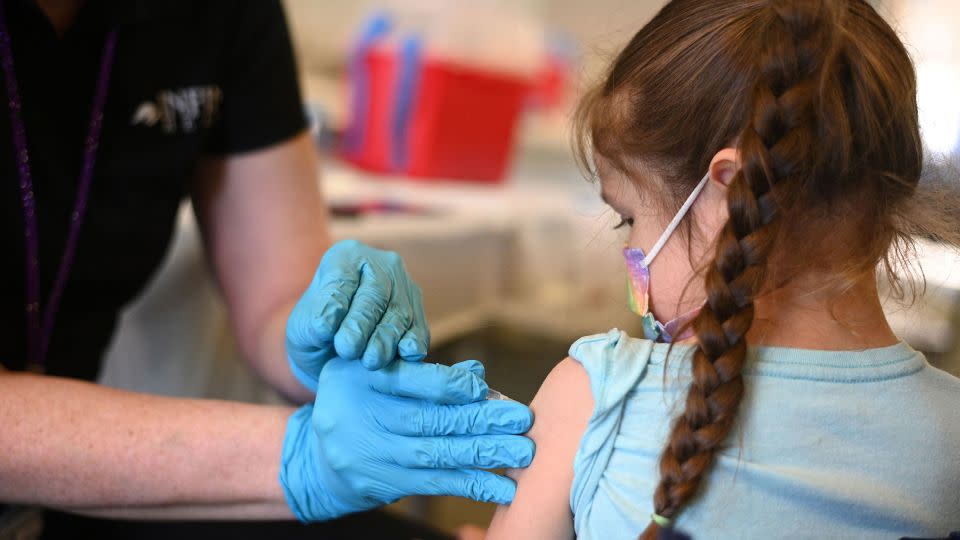 In this January 2022 photo, a nurse administers a pediatric dose of the Covid-19 vaccine to a girl at a clinic at Los Angeles Mission College in the Sylmar neighborhood in Los Angeles. - Robyn Beck/AFP/Getty Images/File