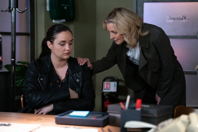 Kathy places her hand on Lauren's shoulder in the Harry's Barn office in EastEnders