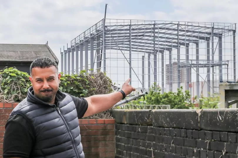 Imran Shaban in his garden.  Nechells in Birmingham on May 15 2025 where a large warehouse unit is being erected near to the Wing Yip Chinese supermarket