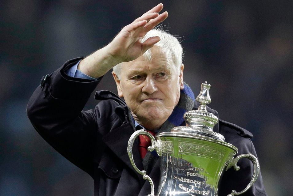 Aston Villa legend Peter McParland shows off the FA Cup to supporters ahead of a game in 2014