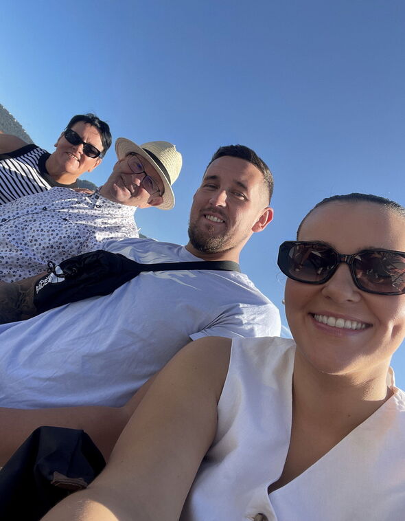 four people smiling 