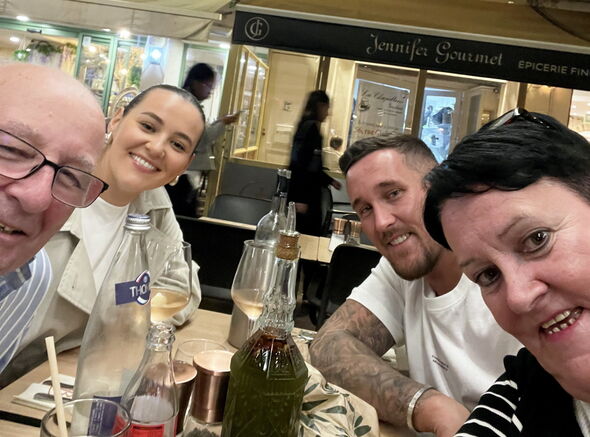 Family smiling in restaurant