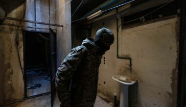 A rebel fighter inspects a room in the Syrian General Intelligence Directorate Branch 251, also known as Al-Khatib branch, in the capital Damascus on December 25, 2024 (Sameer Al-DOUMY)