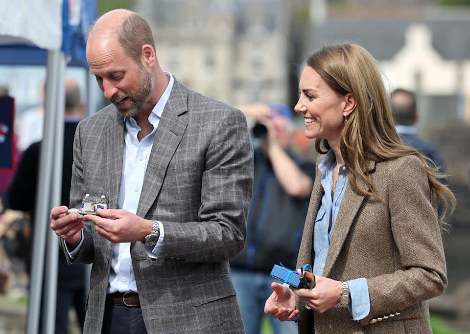 TOBERMORY, SCOTLAND - APRIL 29: Prince William, Prince of Wales, known as the Duke of Rothesay and Catherine, Princess of Wales, known as the Duchess of Rothesay when in Scotland, speak to one of the islands makers and creators during a tour of an artisan market on April 29, 2025 in Tobermory, Scotland. The Prince and Princess of Wales are on a two-day visit to the Isles of Mull and Iona on the 29th and 30th of April to engage with rural island communities. During their time on the islands, they will connect with local residents, highlighting the value of social bonds and underscoring the importance of safeguarding and advocating for the natural environment. (Photo by Chris Jackson/Getty Images)
