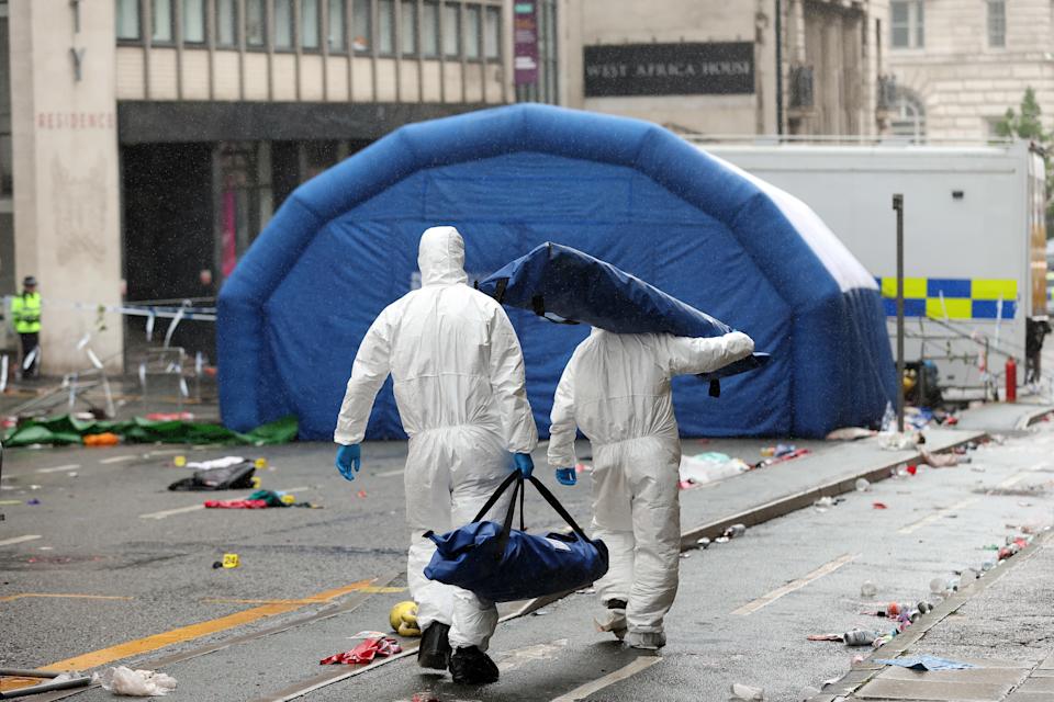 LIVERPOOL, ENGLAND - MAY 27: Crime Scene Investigators at the scene of the Liverpool FC parade incident on Water Street on May 27, 2025 in Liverpool, England. Investigation and cleanup continued this morning after a car ploughed into a crowd gathered yesterday for the Liverpool F.C. victory parade, injuring nearly 50 people, including four children. Authorities said the suspect was arrested and they are not treating it as an act of terrorism. (Photo by Jan Kruger/Getty Images)