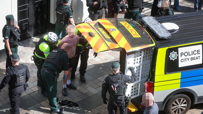 Fifty people watch as daylight brawl breaks out on busy street in Belfast city centre