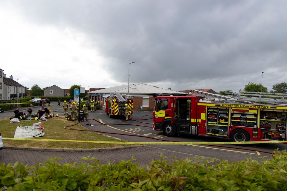 Firefighters at the scene of a chip shop fire.
