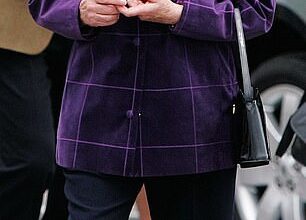 Queen Elizabeth II embarks on the Hebridean Princess at Port Ellen, Scotland, for a cruise around the Western Isles with her family in 2006