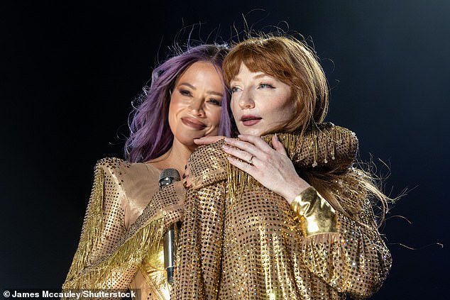 Last summer, Nicola showed off her huge diamond ring on stage at Brighton Pride after Mitch popped the question (pictured with Kimberley Walsh)