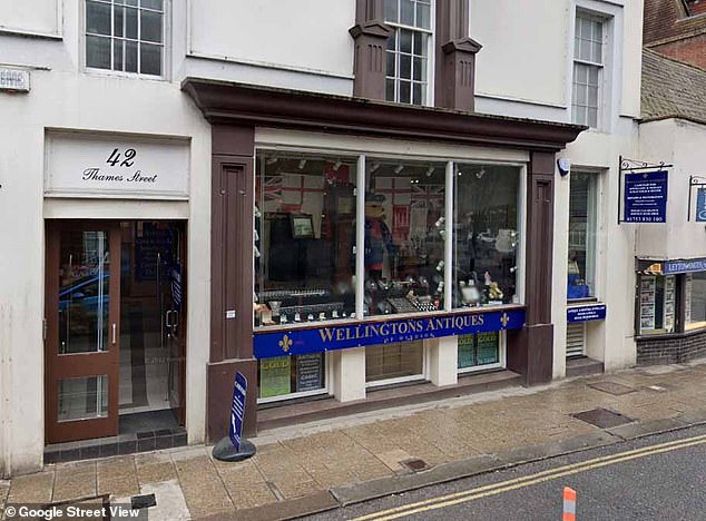 John Wellington was ordered to pay £55,000 to sales assistant Audrey Pereira over remarks he made after she started working at Wellington Antiques in Windsor (pictured)