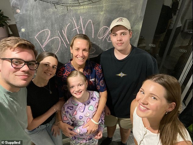 Carly (centre) vows to 'keep going' in her fight against cancer for the sake of her children, (L-R) Coen, 23, Elsie, 10, Ruby, 17 and Nic, 18, pictured with Coen's partner, Kelsie