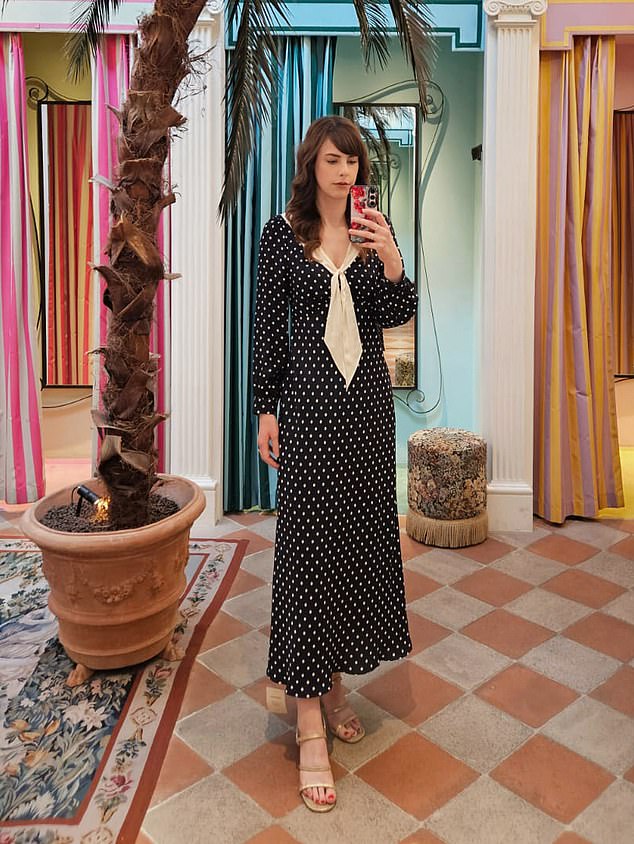 The satin tie-neck adds a luxurious touch to the Lotta dress