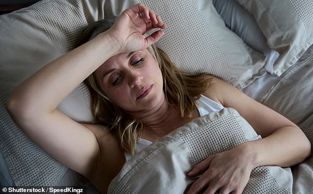 Perimenopausal symptoms include hot flashes, weight gain, brain fog and vaginal dryness (stock image)