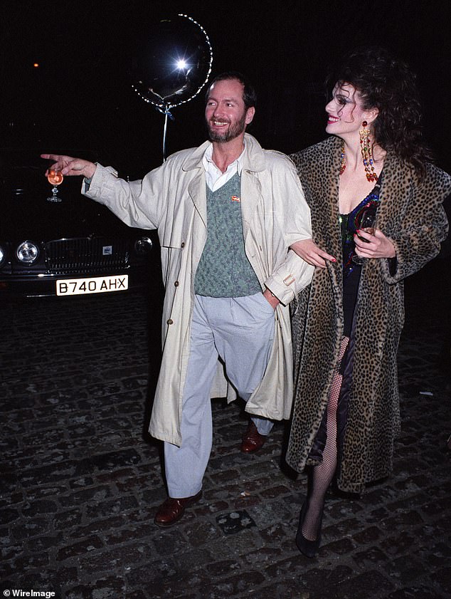 Kenny Everett and Cleo Rocos on a night out in London