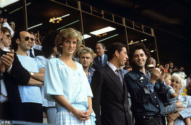 Diana watches the Live Aid concert next to her husband Prince Charles and Bob Geldof
