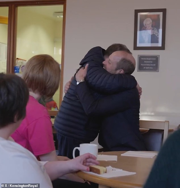 The heir to the throne was also filmed chatting to a man in the centre who went in to hug the Prince and was met with open arms from William, with the pair sharing a heartfelt embrace