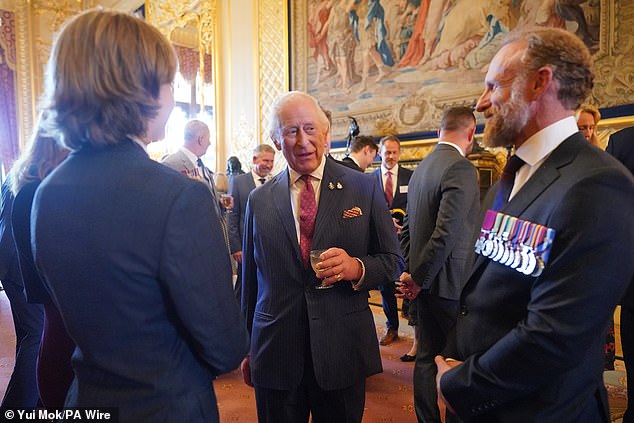 Today's reception for the Victoria and George Cross Association comes one day after the King (centre)  issued a moving message about his 'frightening' cancer diagnosis on Wednesday