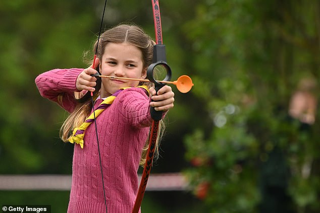 Princess Charlotte of Wales tries her hand at archery while taking part in the Big Help Out, during a visit to the 3rd Upton Scouts Hut in Slough on May 8, 2023