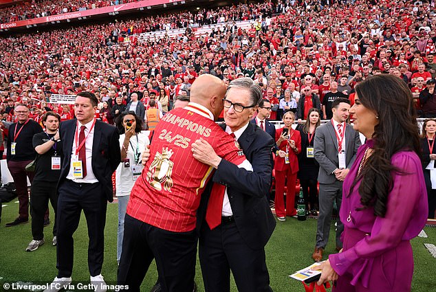 Manager Slot pictured hugging Liverpool owner John Henry after last week's win at Anfield