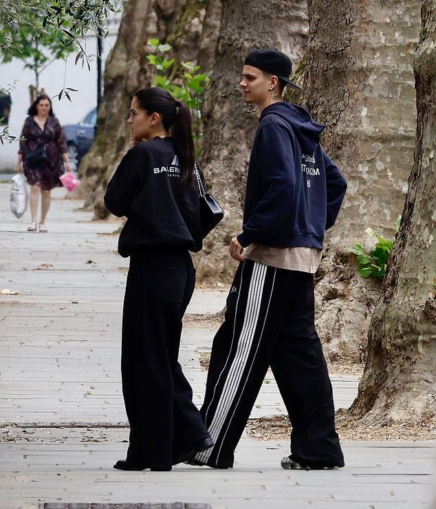 Romeo and Kim both kept it casual in sweat shirts and black bottoms