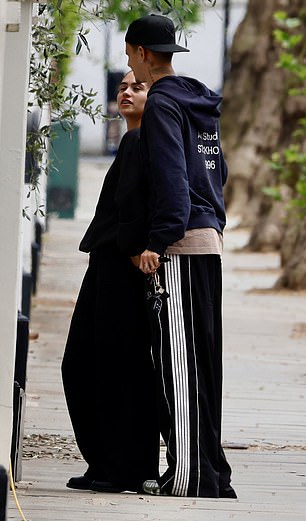 Romeo completed his look with a backwards black baseball cap