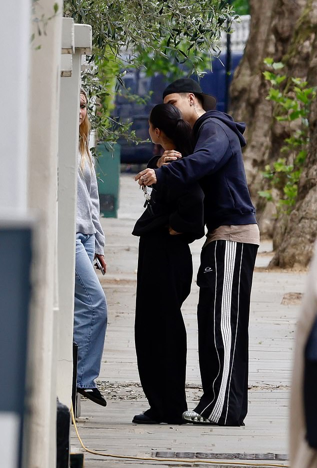 The former footballer, 22, put on a loved up display with model, 23, as he wrapped is arms around her