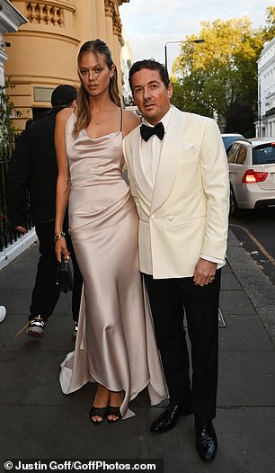 Dave Gardner, 47, also opted for a white tuxedo, as he posed for a picture with stunning Victoria's Secret model girlfriend Jessica Clarke, 31