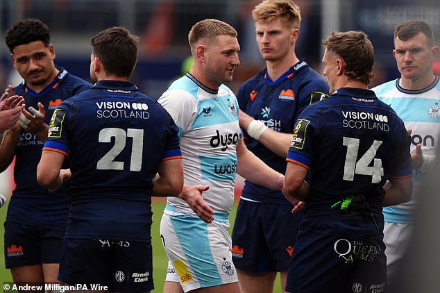 Finn Russell commiserates with Edinburgh winger Darcy Graham after Edinburgh's defeat