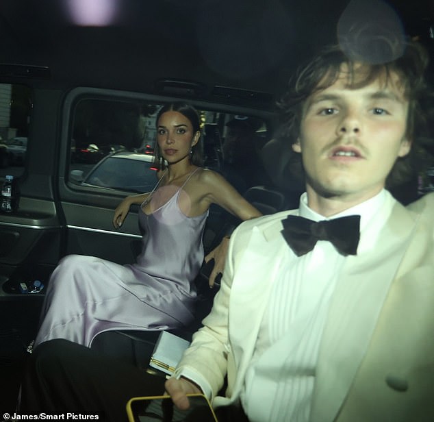 Cruz Beckham, 20, arrived with his girlfriend Jackie Apostel, 29