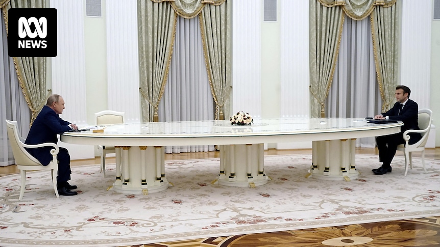 What it's like sitting at Vladimir Putin's very long negotiating table