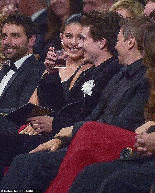 As they took their seat in the audience for the awards show, Kylie and Timothee struggled to hide their laughter as they chatted
